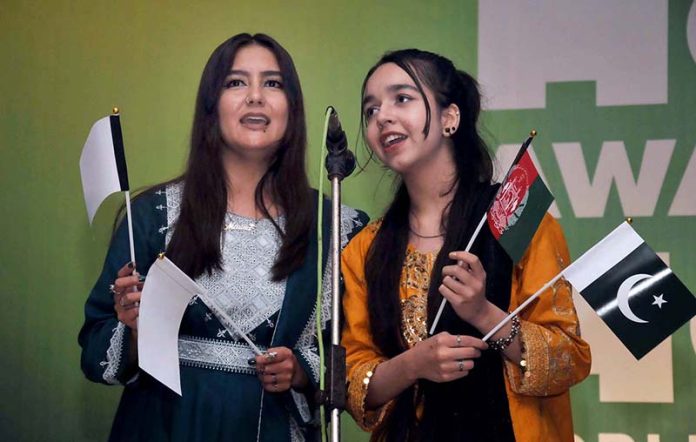 Girls presenting national song during World Refugee day organized by the office of the United Nations for Refugees at local hotel
