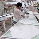 Labourer making ceilings to be used in the houses at Khyban-e-Sir Syed