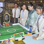 A student visits a science stall at the closing session of International EdTech Conference
