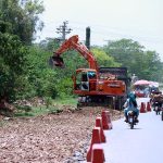 Heavy machinery being used to a expand a road at Chak Shahzad neighbourhood in the Federal Capital