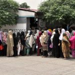 A large number of women in a queue to purchase subsidized flour at Utility store H-9 weekly bazaar in Federal Capital Territory