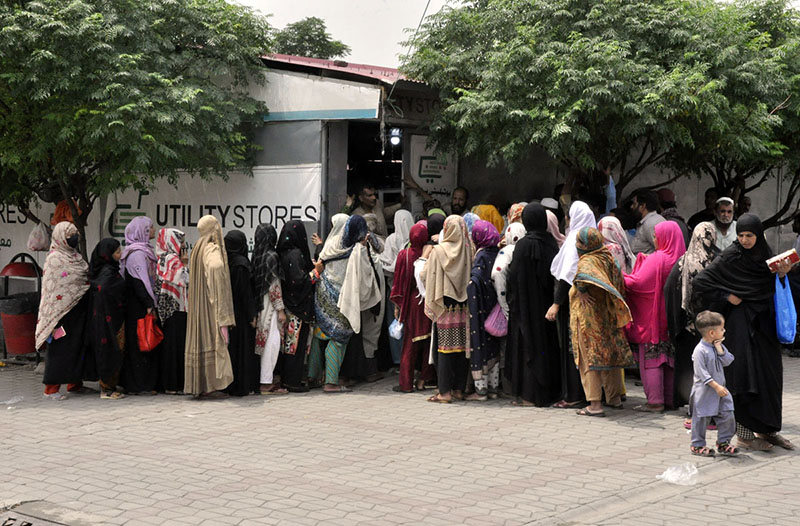 A large number of women in a queue to purchase subsidized flour at Utility store H-9 weekly bazaar in Federal Capital Territory