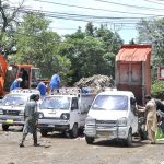TMA staffers removing offal and remains of sacrificial animal on the 2nd day of Eid ul Azha at Satellite Town