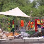 A vendor displaying ornaments of sacrificial animals to attract customers at Ghouri Town