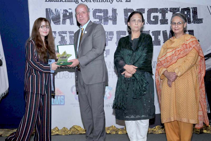 Country Representative, UNFPA, Dr. Luay Shabaneh, Member Parliament and Secretary of Women's Parliamentary Caucus Dr. Shahida Rehmani and Vice Chancellor Fatima Jinnah Women University Dr Saima Hamid in a group photo with participants during the launching ceremony of the 2nd Naqsh Digital Film Festival (NDFF) organized by Department of Communication and Media Studies, Fatima Jinnah Women University