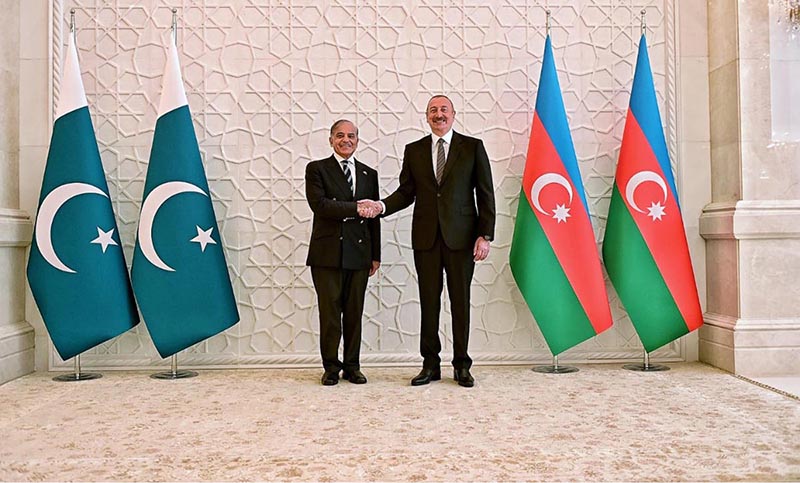 Prime Minister Muhammad Shehbaz Sharif and President of Azerbaijan Ilham Aliyev shaking hands prior to their meeting