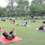 People are doing yoga exercise to keep themselves healthy and stress free on the World Yoga Day at Bagh-e-Jinnah
