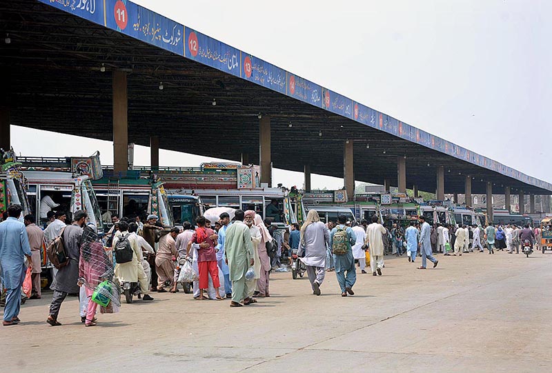 A large number of people arrives at General Bus Stand to leave for hometowns to celebrate Eidul Azha with their loved ones
