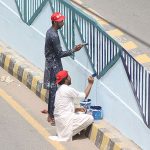 Workers are painting on the Kalma Chowk Flyover