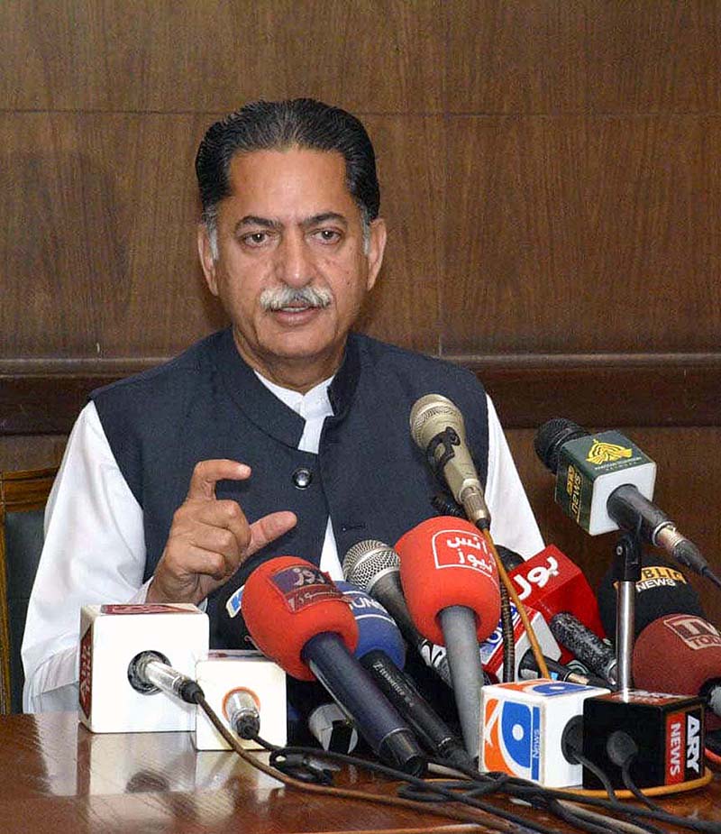 Federal Minister Javed Latif holding a press conference
