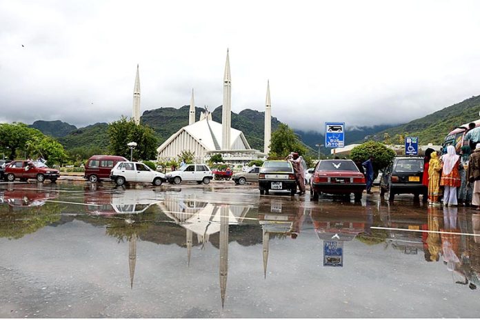 Clouds hovering over the Faisal Mosque after heavy rain