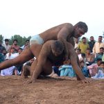 Wrestlers in action during First Begum Kulsoom Nawaz Memorial Fateh Faisalabad Dangal organized by Municipal Corporation at Bohran wali Ground
