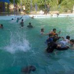 People enjoying swimming at Water Park during hot weather