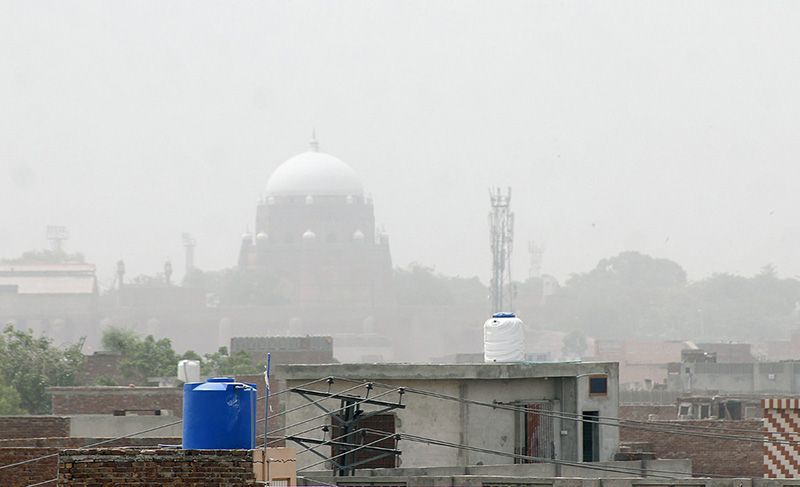 A view of the Shrine of Shah Ruknuddin Alam covered with Dust storm in the city