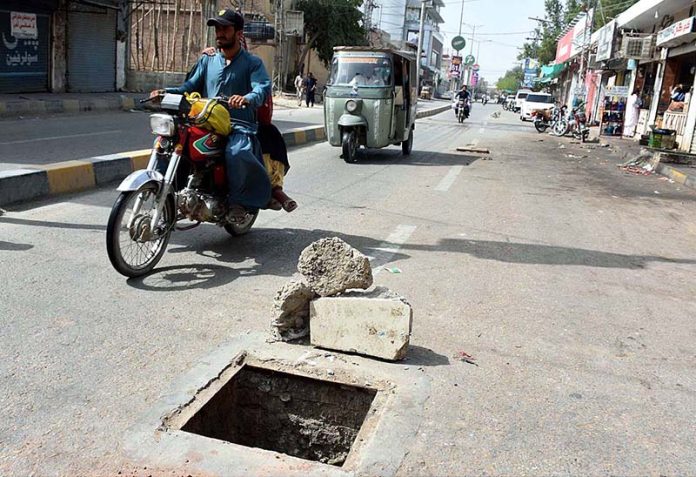 A view of open manhole on the Railway Station Road