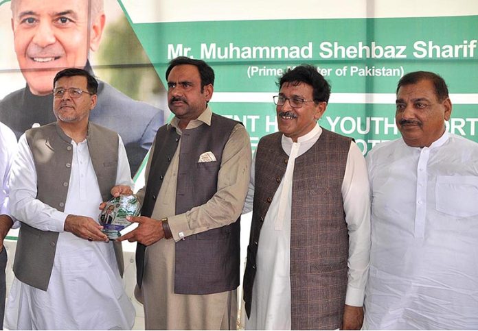 VC University of Sargodha Prof. Dr. Qaisar Abbas giving a shield to PML(N) Former MPA Rana Munawar Ghous during Men & Women Football trials for Prime Minister's Youth Programe Talent Hunt Youth Sports League organized by University of Sargodha Supervision of Higher Education Commission