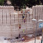 Workers repairing the wall of the historical Pakka Fort to restore by Heritage Department at Station Road