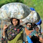 Ladies on the way back carrying huge bundles on their heads