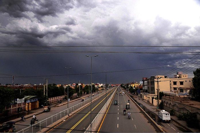 After the rain in the city, a captivating sight unfolds as dark clouds hover over the sky, creating a dramatic and alluring atmosphere After the rain in the city, a captivating sight unfolds as dark clouds hover over the sky, creating a dramatic and alluring atmosphere