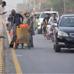 Workers marking road lines on Jhumra Road