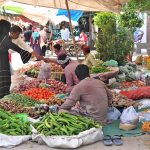 People busy in purchasing vegetables at Friday Bazar