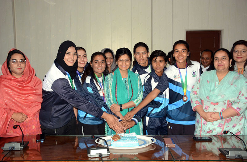 Vice Chancellor GC Women University Faisalabad (GCWUF), Prof Dr Robina Farooq is cutting cake during a ceremony organized to celebrate achievements of GCWUF Sports Stars in the 34th National Games 2023 in Quetta