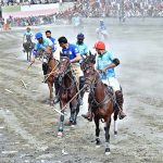 Players from NLI (B) and GBPWD teams in action during the Jashn-e-Baharan freestyle Polo Tournament at Aga Khan Shahi Pologround.