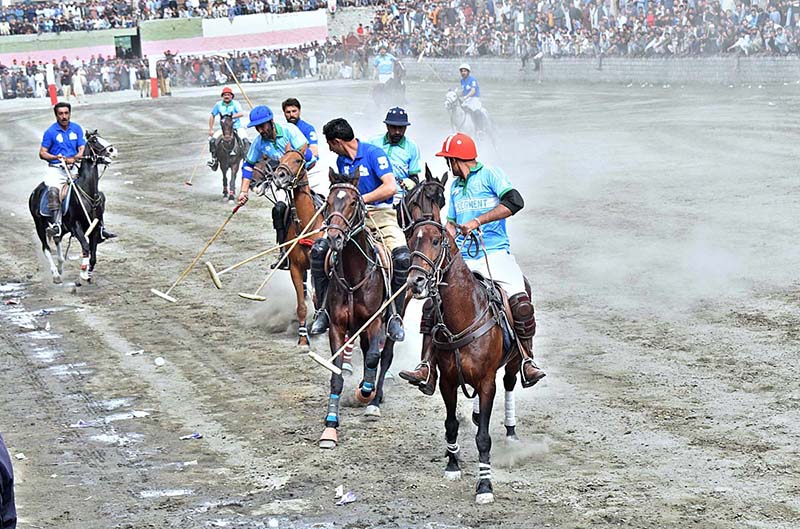 Players from NLI (B) and GBPWD teams in action during the Jashn-e-Baharan freestyle Polo Tournament at Aga Khan Shahi Pologround