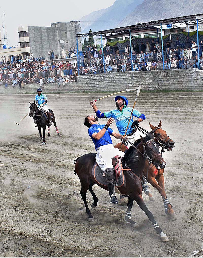 Players from NLI (B) and GBPWD teams in action during the Jashn-e-Baharan freestyle Polo Tournament at Aga Khan Shahi Pologround