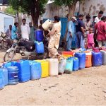 People filling their pots with clean water from Filter plant at Latifabad
