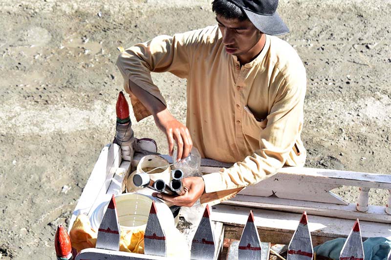 A vendor busy in preparing qulfi at his road side setup to attract customers