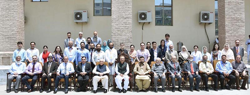 President Dr. Arif Alvi in a group photo with the organizers and participants of the International Conference on Health Research