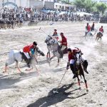 Players from Halqa-01 and Gilgit-01 teams in action during the 2nd semi final of Jashn-e-Baharan Free Style Polo Tournament at Aga Khan Shahi Polo Ground