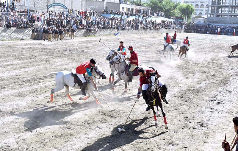 Players from Halqa-01 and Gilgit-01 teams in action during the 2nd semi final of Jashn-e-Baharan Free Style Polo Tournament at Aga Khan Shahi Polo Ground