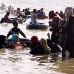 Large number of people enjoying bathing in Keenjhar lake people come here for picnics during the summer school holidays to get relief from hot weather