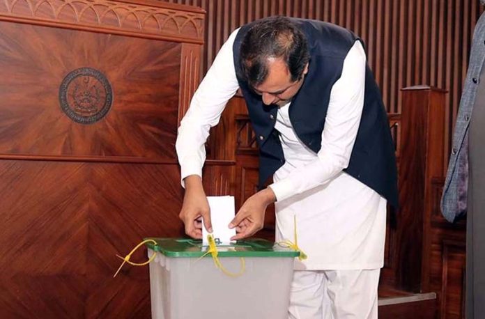 Chief Minister Gilgit-Baltistan Khalid Khurshid Khan casting his ballot for the No Confident Motion against the Speaker Gilgit-Baltistan Assembly Syed Amjad Ali Zaidi during the 4th sitting of 19th session of GB Assembly under the chair of Deputy Speaker Nazir Ahmad Advocate at Assembly Secretariat