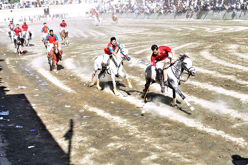 Players from Halqa-01 and Gilgit-01 teams in action during the 2nd semi final of Jashn-e-Baharan Free Style Polo Tournament at Aga Khan Shahi Polo Ground