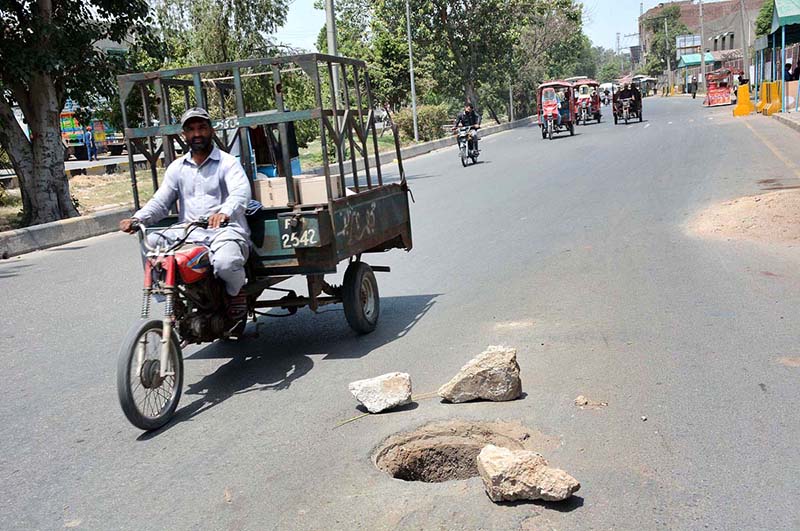An open sewerage main hole in the right middle of Rajbah Sirwala Road near Lal Mills Chowk is posing serious threats for the road users as the concerned department has left it unattended for the last many weeks