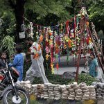 A vendor displaying and selling decorative stuff for sacrificial animals at roadside I-10 sector in Federal Capital