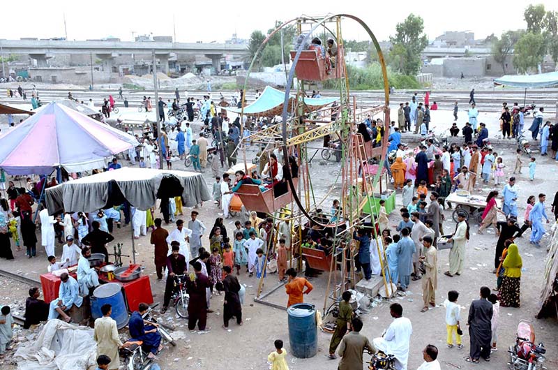 Children enjoying camel ride during the 1st day of Eid Ul Azha near Railway Station