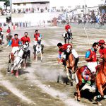 Players from Halqa-01 and Gilgit-01 teams in action during the 2nd semi final of Jashn-e-Baharan Free Style Polo Tournament at Aga Khan Shahi Polo Ground