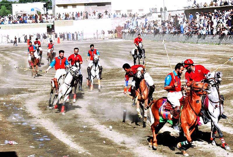 Players from Halqa-01 and Gilgit-01 teams in action during the 2nd semi final of Jashn-e-Baharan Free Style Polo Tournament at Aga Khan Shahi Polo Ground