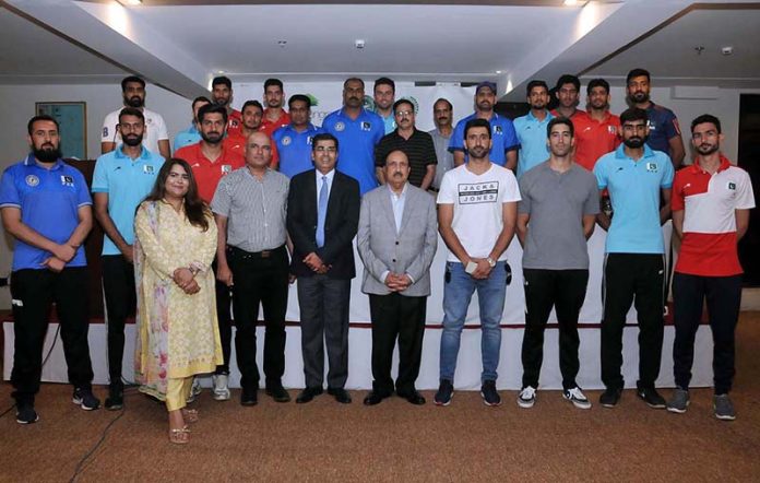 Chairman Pakistan Volleyball Federation, Chaudhry Muhammad Yaqoob in a group photograph with players of Pakistan team for winning Engro Central Asian Championship at hotel Best Western