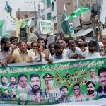 People participating in a walk-in rally to express their solidarity with the Pak army organized by Pasban Rickshaw Taxi Driver Union Register Punjab at Chowk Aziz