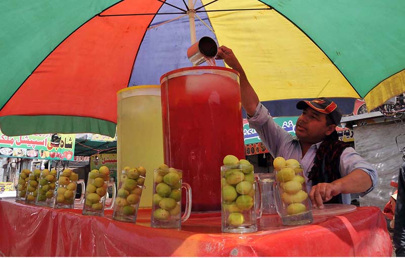 A vendor selling traditional summer drink at his roadside setup