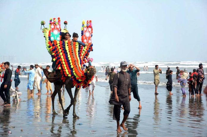 Children enjoying camel ride at Sea View Clifton on the 2nd day of Eid-ul-Adha celebrations