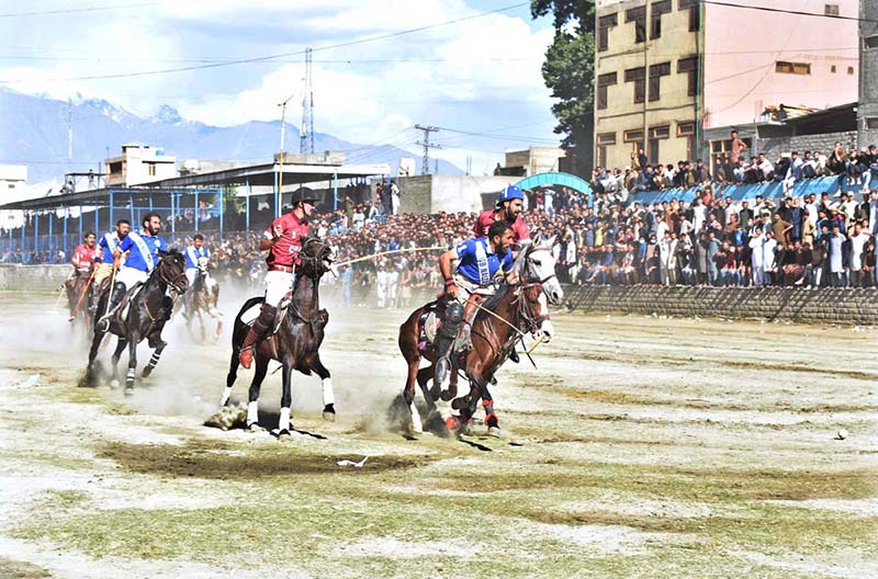 Players from GB Nalter and GB Sub Division 01 teams in action during the Jashn-e-Baharan Freestyle Polo Tournament at Aga Khan Shahi Polo Ground