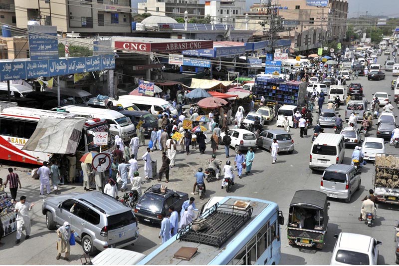A large number of people purchasing tickets and waiting for transport to travel their hometowns at Faizabad Bus Stand to celebrate Eid ul Azha with their loved ones