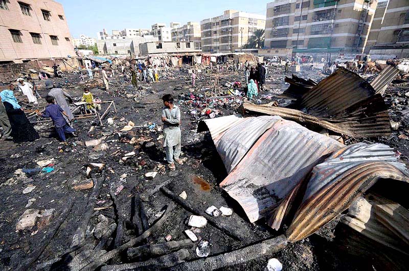 Several huts burnt to ashes during a fire that erupted in a shanty town along Gulistan Jauhar