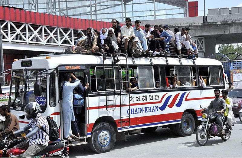 A large number of people purchasing tickets and waiting for transport to travel their hometowns at Faizabad Bus Stand to celebrate Eid ul Azha with their loved ones